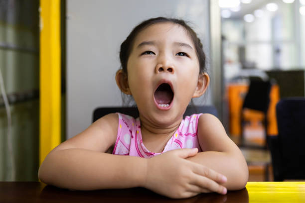 little girl Yawning stock photo