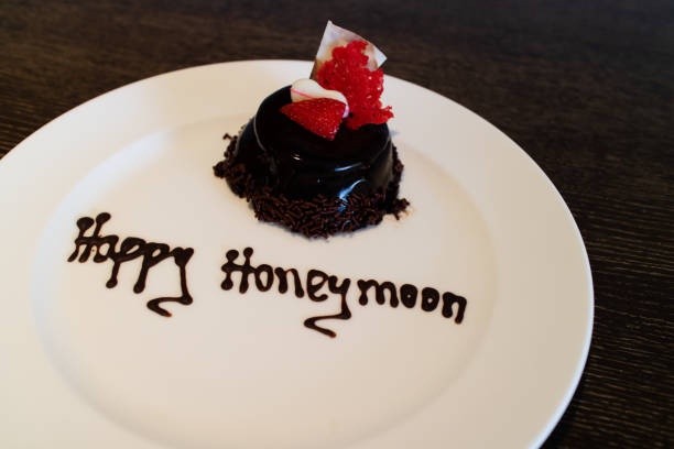 istock A honeymoon cake isolated on a wooden background 1166308211