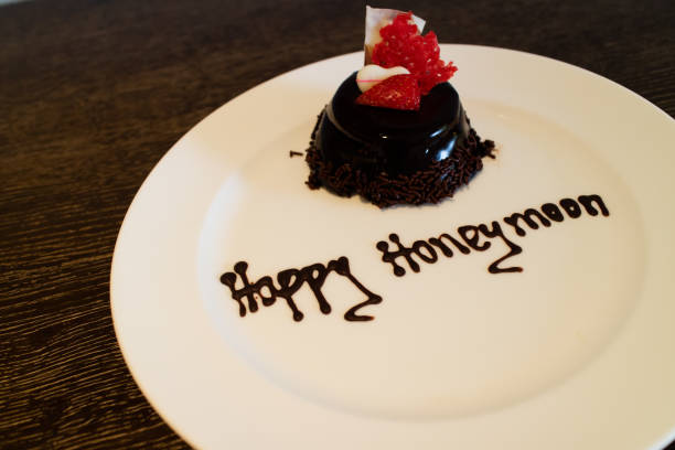 istock A honeymoon cake isolated on a wooden background 1166308212