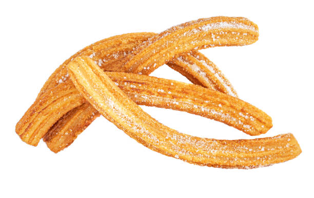 istock Churros isolated on white background. Mexican cuisine - Churro with sugar, top view 1166312358