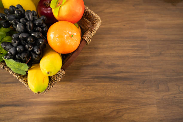 Vegetable for making salad and fruits in basket on table