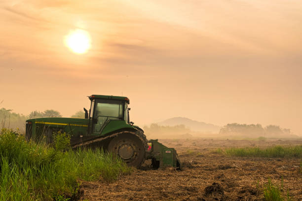 istock A tractor standing on a field VD702 1166318047
