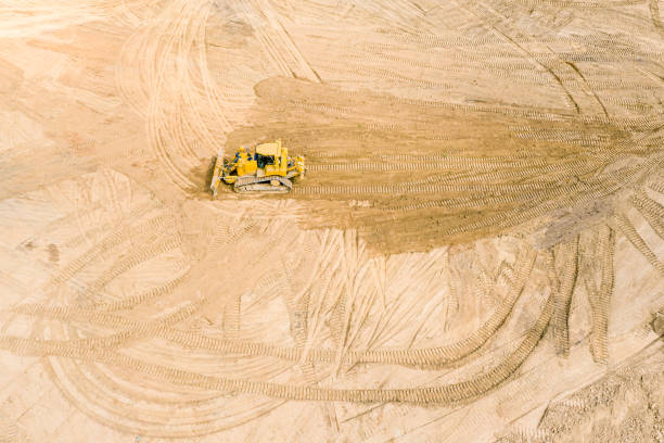 istock industrial yellow bulldozer leveling soil before road construction 1166318122