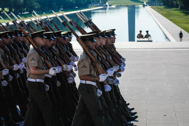 Washington, D.C., USA - July 22, 2019: The US Marine Corp Honor Guard enact their color guard ceremonies at dawn. The ceremonies take place at dawn at the base of the Lincoln Memorial