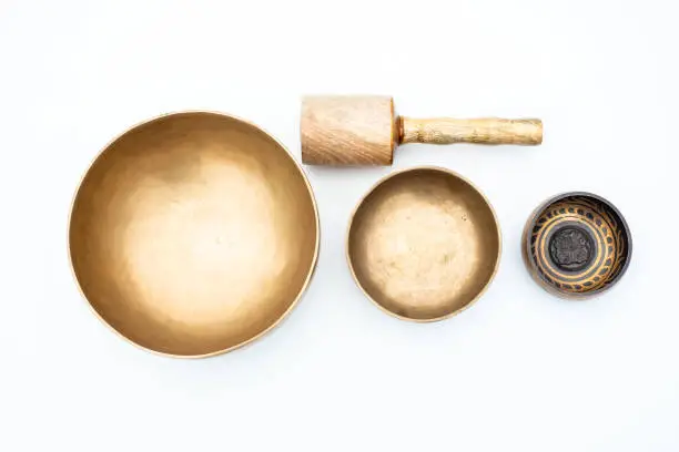 Flat lay composition of Ancient hand crafted traditional Tibetan meditation and healing singing bowls made from 7 sacred metals which are typical accessories used in buddhism, yoga and meditation