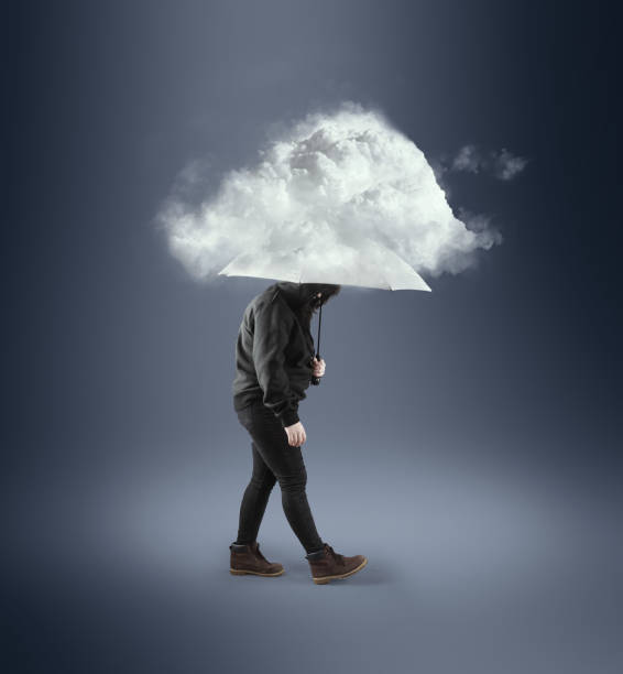 istock Woman with an umbrella under a rainy cloud. 1166327173