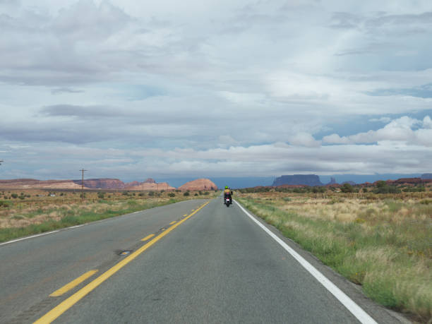 istock lonely Biker on Arizona desert road 1166328214