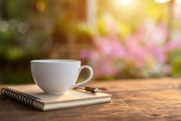 istock White ceramic coffee cup on wooden table or counter 1166330448