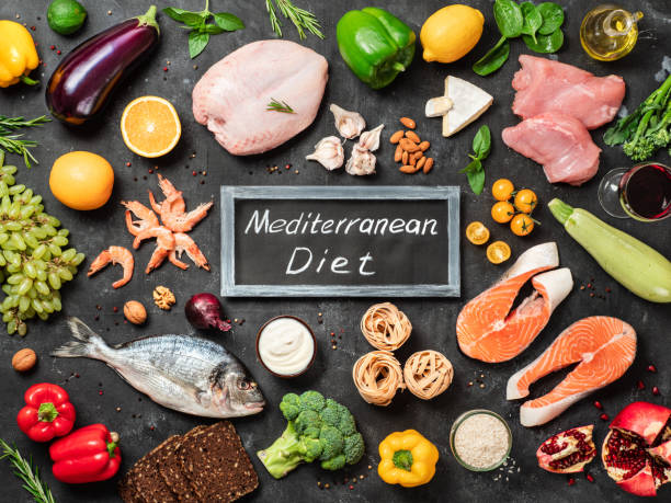 Mediterranean diet concept, flat lay Mediterranean diet concept. Top view of food ingredients and chalkboard with words Mediterranean Diet in center. Dark background. Flat lay. mediterranean food photos stock pictures, royalty-free photos & images