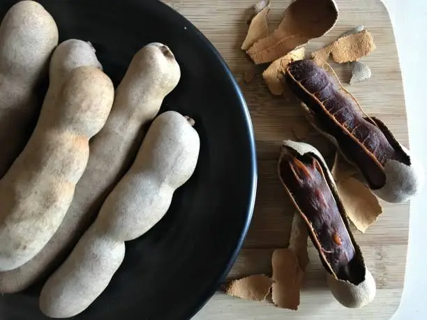 Photo of Fresh organic Tamarind fruits.