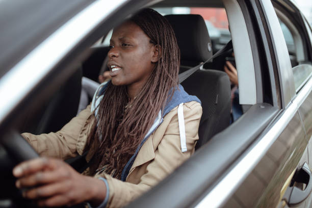 istock Mother driving kids to school 1166335569