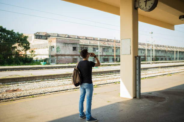 Tourist backpacker to travel at train station