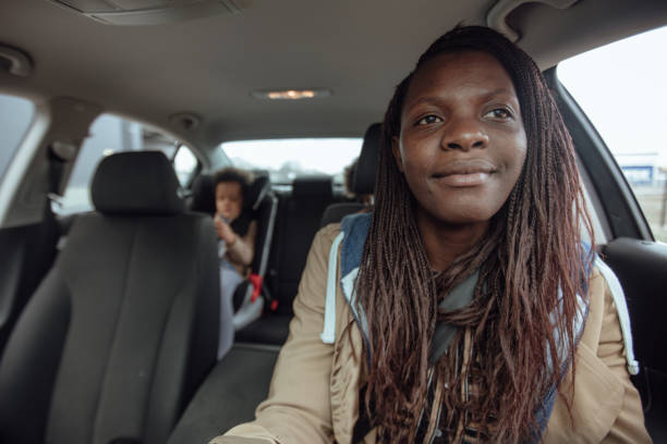 istock Mother driving kids to school 1166336768