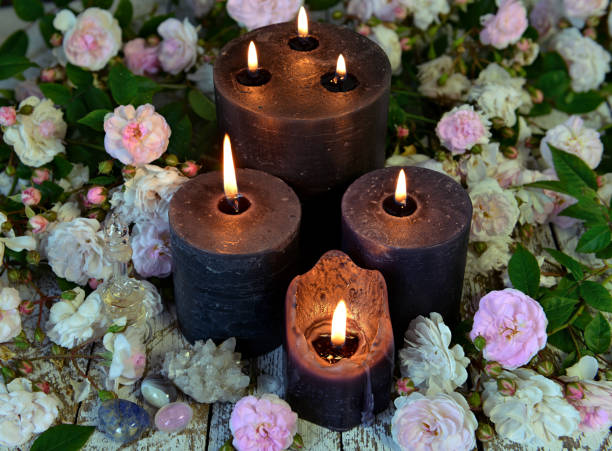 istock Still life with black candles and roses on green witch table. 1166337113