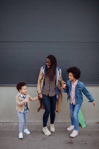 istock Mother having fun with her two daughters 1166337153