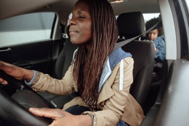 istock Mother driving kids to school 1166337984