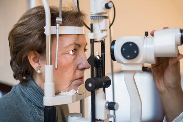 Eye testing Senior woman during an eye testing. About 60 years old female patient, Caucasian. glaucoma photos stock pictures, royalty-free photos & images