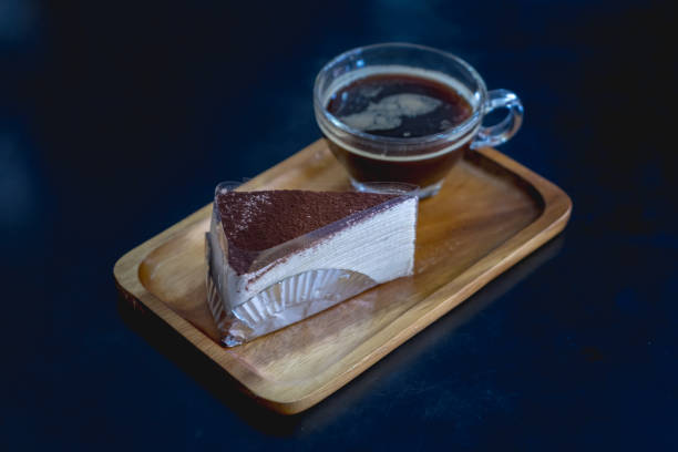 istock Nutella cake crepes with coffee on a wooden plate 1166339232