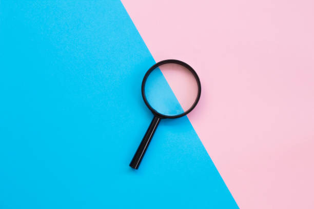 istock A colorful background with magnifying glass 1166339349