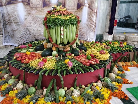 Closeup of Hindu God Idol Shiva decorated with fruits and vegetables