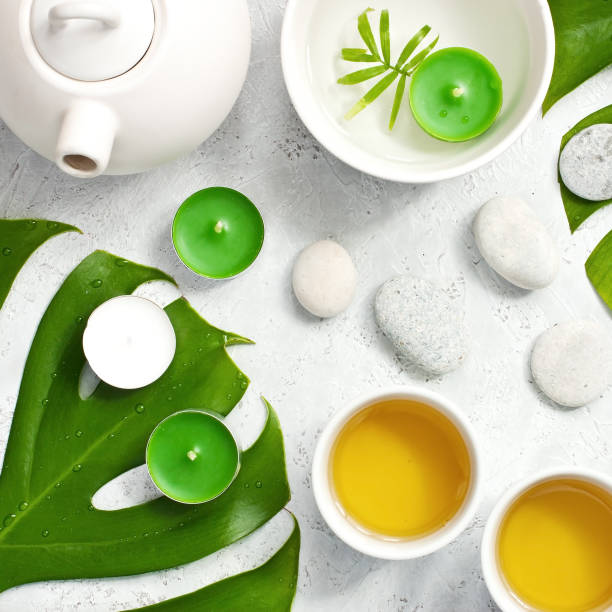 istock Green  tea and teapot  on stone table. Top view 1166344272