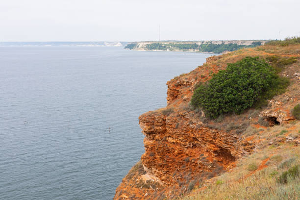 istock Rocky clay cliffs at the beach 1166345335