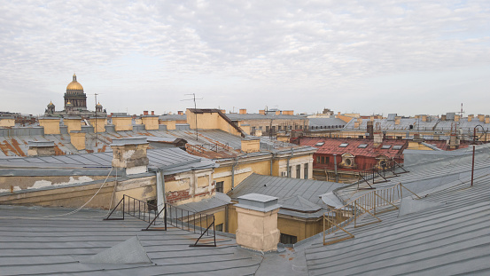 Panoramic view of the city of St. Petersburg. View of the roofs of the city and the Dome of St. Isaac's Cathedral. Walk on the roofs in St. Petersburg, Russia. A romantic picture, a place for a label.