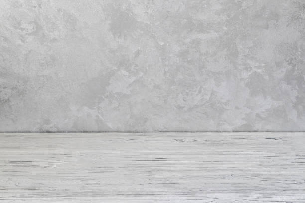 istock Wooden floor over concrete or decorative plaster wall background. 1166346981