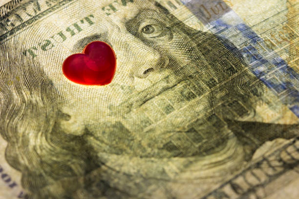 Hundred dollar banknote of usa. eyes of Franklin are closed by hearts .  Concept financial love and a gift for Valentine`s Day Hundred dollar banknote of usa. eyes of Franklin are closed by hearts .  Concept financial love and a gift for Valentine`s Day valentinstag stock pictures, royalty-free photos & images