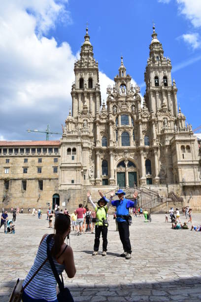 Santiago de Compostela, Spain. August 3, 2019. Plaza del Obradoiro, Cathedral with tourists taking pictures. A Coruña Province, Galicia Region.