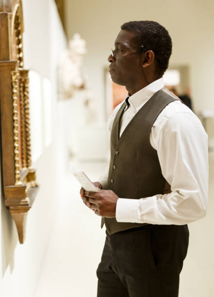 istock Mature afro man visiting Art Museum 1166352535