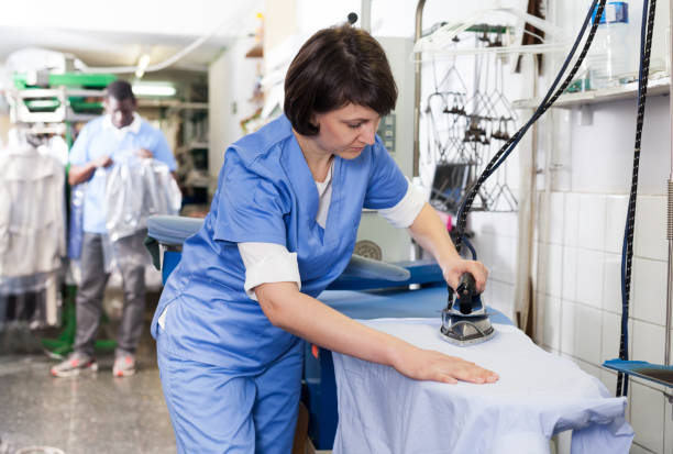 istock Girl ironing in laundry 1166352917