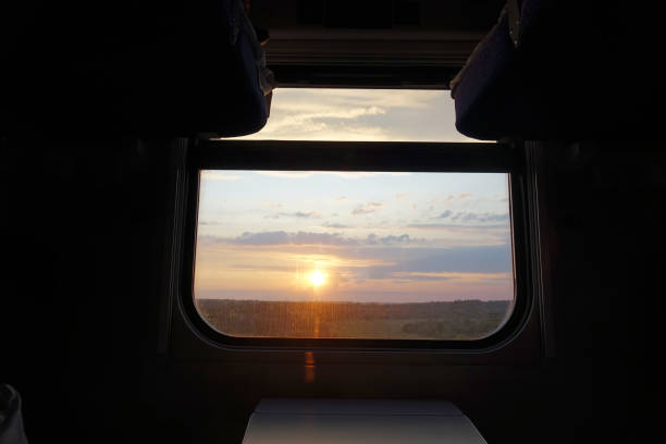 istock beautiful sunset view from the window of a train car 1166354931