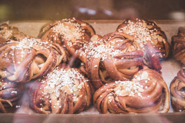 istock Various baking buns on showcase in a supermarket or bakery 1166355281