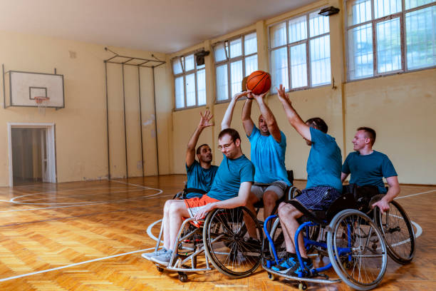 istock Disabled sport men in action while playing indoor basketball 1166356467
