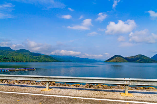istock Waterproof dam with blue sky have emerald water and clear 1166360087