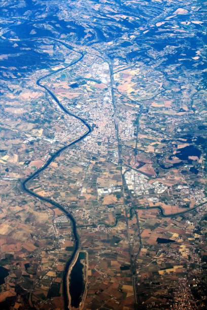 istock Italian town bordered by a river seen from a plane 1166360412