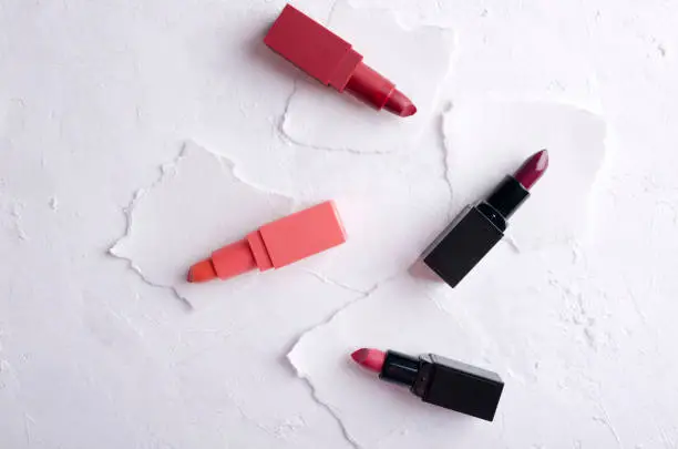 Photo of Examples of different colors of lipsticks on the paper