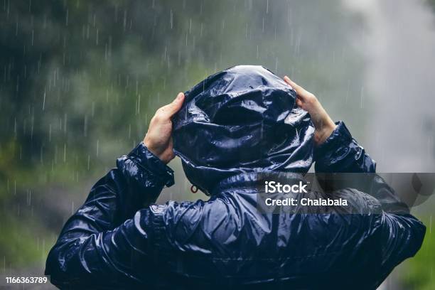 Traveler In Heavy Rain Stock Photo - Download Image Now - Raincoat, Men, Rain