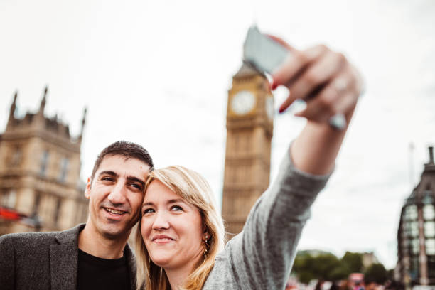 istock happiness friend in london take a selfie 1166364773