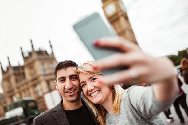 istock happiness friend in london take a selfie 1166364853