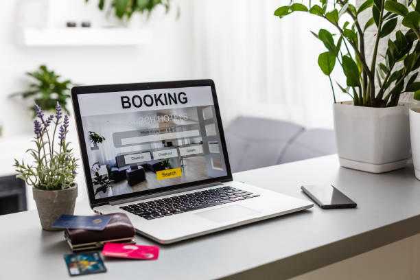 istock credit card and computer with app hotel booking screen 1166364927