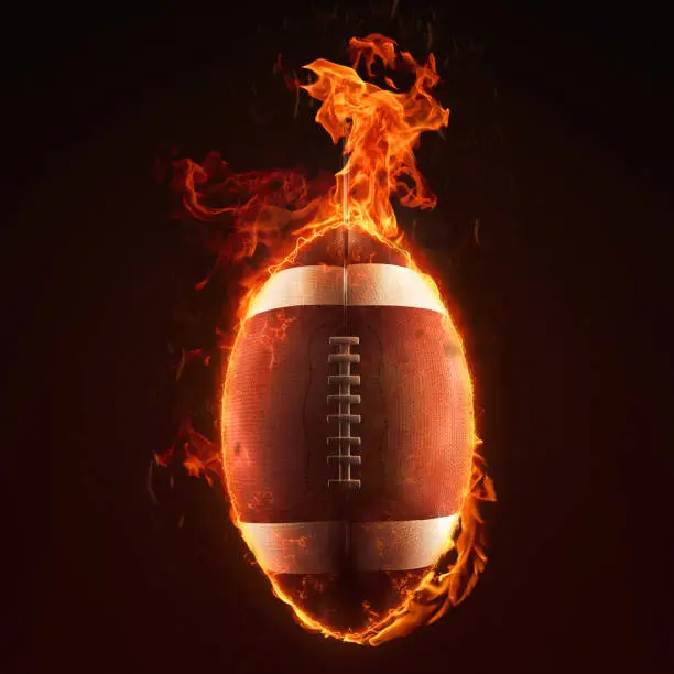 American football ball in flames