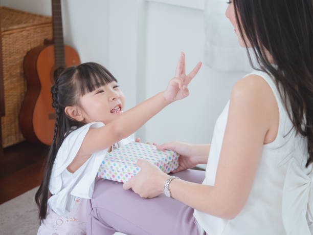 istock Daughter gave the mother a gift with love 1166366471