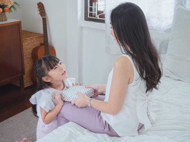 istock Daughter gave the mother a gift with love 1166366480