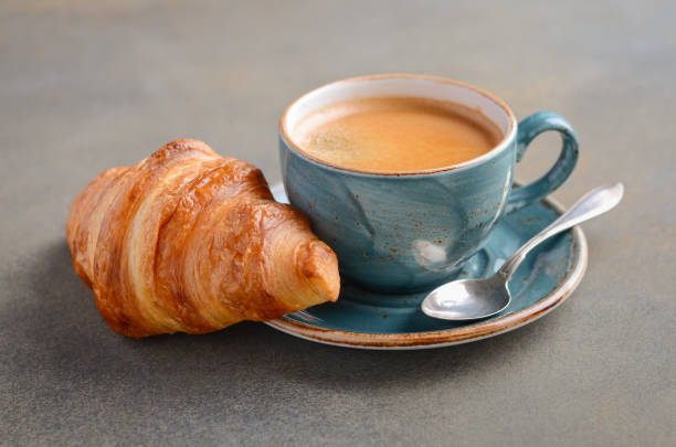 istock Cup of fresh coffee with croissant. 1166367659
