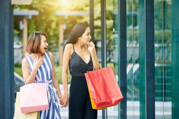 istock Two friends going for shopping 1166373277