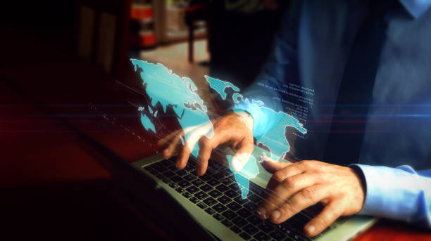 istock Man typing on keyboard with world map hologram 1166376243