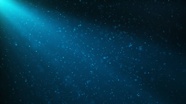 istock Abstract particles background of shining, sparkling blue particles. Beautiful blue floating dust particles with shine light. 3D Rendering 1166376531