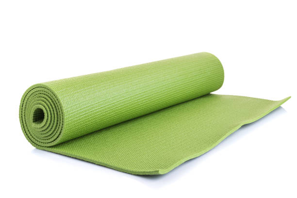 istock New green soft Yoga mat. Studio shot isolated on white 1166376538